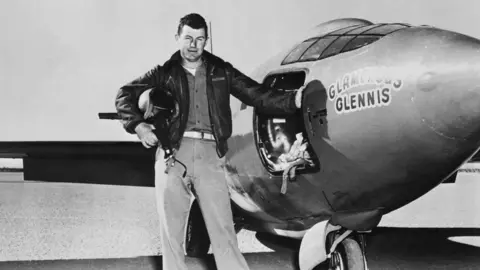 Getty Images Chuck Yeager besides the Bell X-1 plane