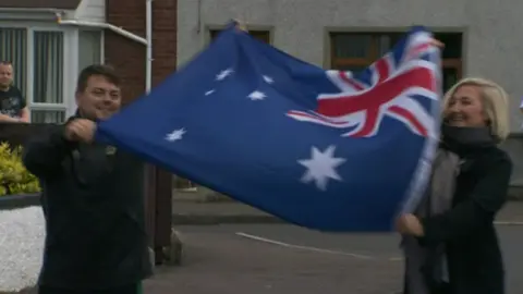 People holding Australian flag