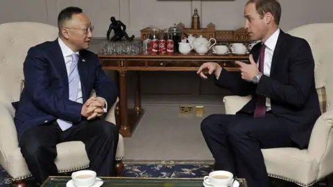 Getty Images Britain's Prince William, Duke of Cambridge with Sanpower Group Chairman Yuan Yafei, at Kensington Palace Oct 2015 where the Prince, in his role as President of United For Wildlife, attended the signing of a memorandum of understanding between The Royal Foundation of The Duke and Duchess of Cambridge and Prince Harry and Sanpower, enabling United for Wildlife to create two ranger training stations in Africa