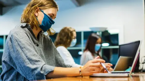 Getty Images Students wearing masks