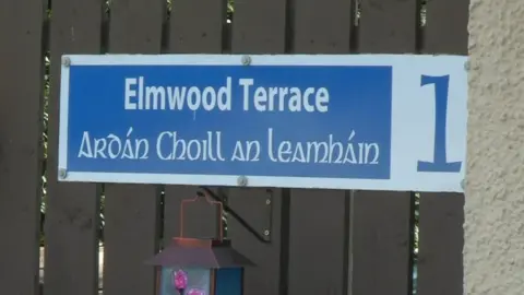 An unofficial sign in Lurgan shows a street name in English and Irish