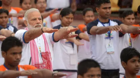 Getty Images Narendra Modi doing yoga
