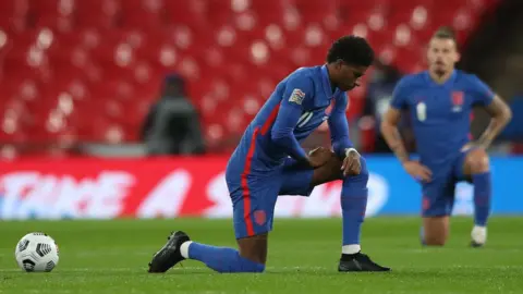 Getty Images Marcus Rashford taking the knee