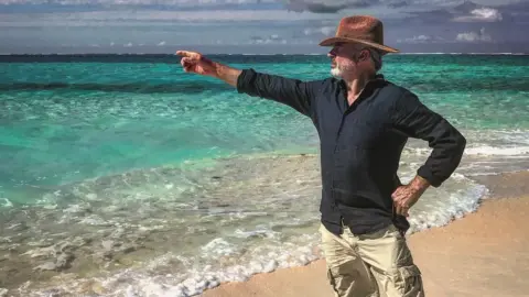 Sam Neill and family Sam Neill pictured on a beach