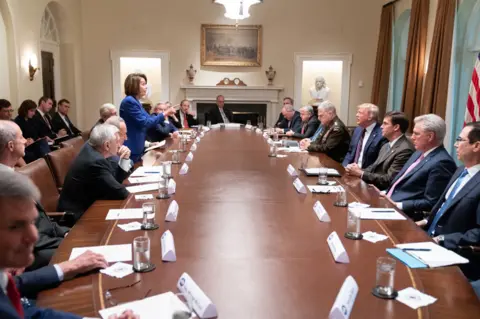White House Nancy Pelosi stands up and points during an explosive meeting on Syria