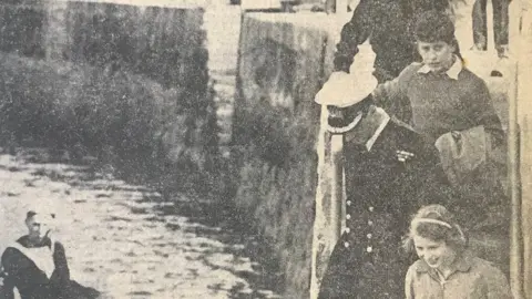 Belfast Telegraph Prince Charles (top right) and his sister Princess Anne on Bangor Pier in 1961