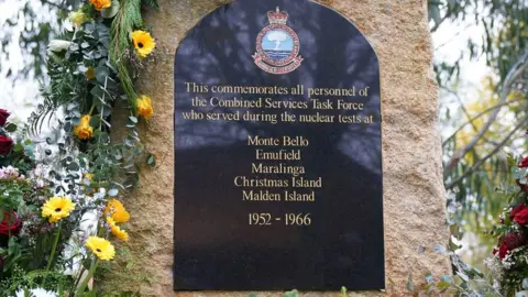 PA Media The plaque for the Nuclear test veterans at the National Memorial Arboretum in Alrewas, Staffordshire