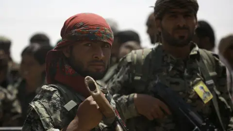 AFP Syrian Democratic Forces (SDF) fighters in the village of Hazima, Syria (6 June 2017)