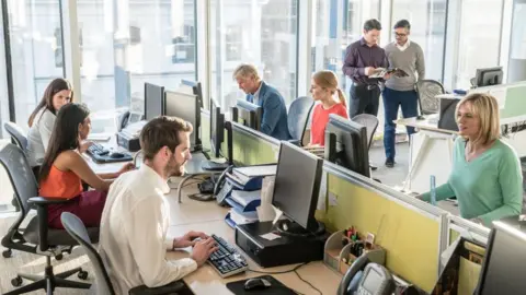 Getty Images Women and men at work