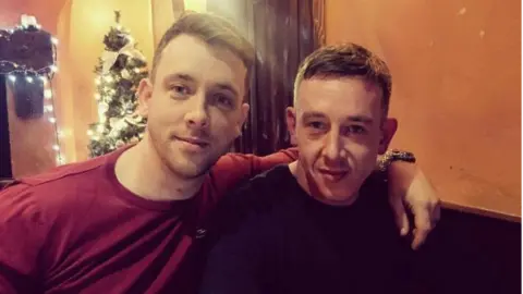 Family handout Matthew Gales, left, with his twin brother James