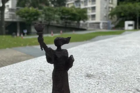 SUPPLIED A figurine in the same location on campus where the statue once stood