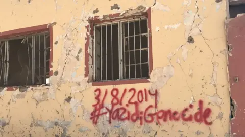 Getty Images A damaged wall in Sinjar