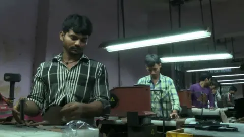 Workers in a shoe factory