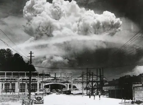 Handout/Getty Images View of the radioactive plume from the bomb dropped on Nagasaki City, as seen from 9.6 km away, in Koyagi-jima, Japan, on 9 August, 1945