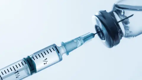 Getty Images Syringe in bottle