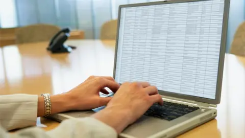 Getty Images Stock image showing a spreadsheet with details on a laptop