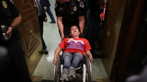 Getty Images Colleen Flanigan is arrested by Capitol Hill police.