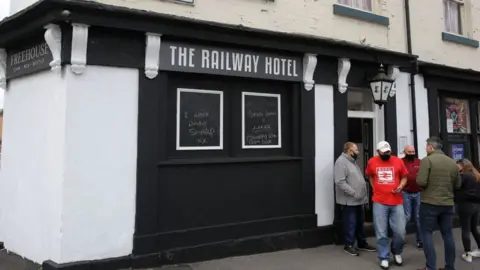 Mark Leech/Offside/Getty Images People outside pub in Sheffield