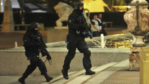 Reuters/MEN/Pool Armed officers take part in a training drill simulating an armed attack