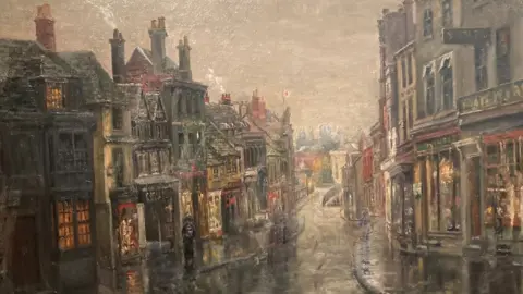 Chippenham Museum An early 1900s painting of Chippenham's high street with a dark grey sky