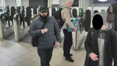 Met Police Khan passing through London Underground