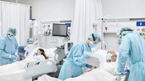 Getty Images File picture of patients being treated in ICU