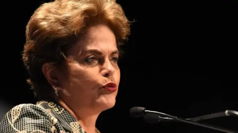 Getty Images Former President of Brazil Dilma Rousseff speaking at a conference in 2017.