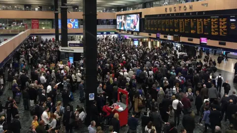 BBC Commuters on the concourse at Euston station