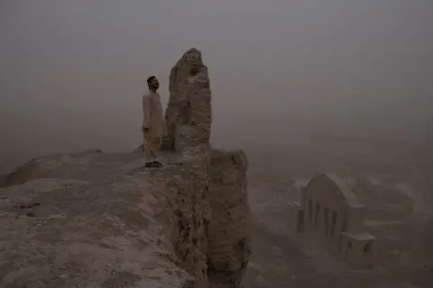 Andrew Quilty Afghan journalist Aliyas Dayee inside the 11th century city of Qala-e Bost which is most famous for its archway, built by the Ghaznavids. Bost is a half hour drive from the capital of Helmand Province Lashkar Gah.