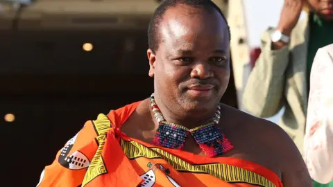 Getty Images King Mswati descending from a plane in 2019