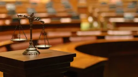 Vladstudioraw Decorative Scales of Justice in the Courtroom