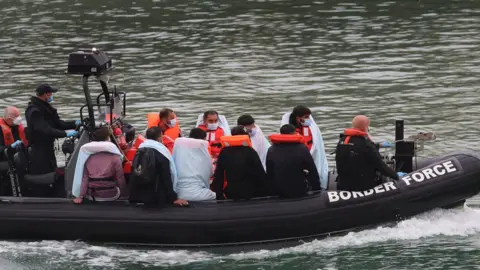 PA Media A group of people thought to be migrants onboard a Border Force vessel on Sunday