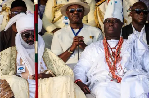 SAMUEL ALABI/ AFP The Sultan of Kano and the Ooni of Ife dressed in white traditional clothes.