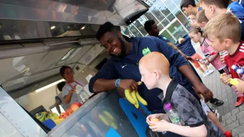 Launch Foods The kids queue up for their healthy food