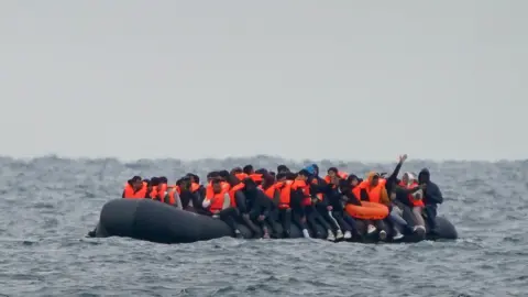 PA Media People in a boat in the English Channel