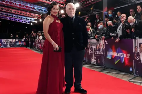 PA Media Nicole Ansari-Cox and Brian Cox arrive for the world premiere of 'Succession', at the Royal Festival Hall in London during the BFI London Film Festival. Issue date: Friday October 15, 2021.