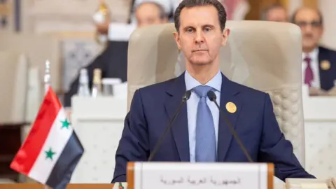 Reuters Syrian President Bashar al-Assad (L) attends the Joint Arab Islamic Extraordinary Summit in Riyadh, Saudi Arabia (11 November 2023)