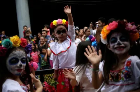 Reuters Young girls dressed as Catrina take part in a parade ahead of Day of the Dead in Monterrey, Mexico October 27, 2019