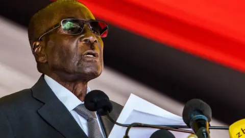 AFP/Getty Zimbabwe's President Robert Mugabe speaks during the burial of Brigadier General James Murozvi, who was granted national hero status by President Robert Mugabe, at the National Heroes Acre in Harare, on April 12, 2017. / AFP PHOTO / Jekesai NJIKIZANA (Photo credit should read JEKESAI NJIKIZANA/AFP/Getty Images)