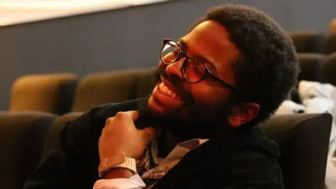 Gboyega at the Barbican Young Poets rehearsal in 2019