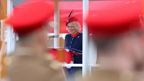 PA Media Queen Camilla addresses the 152 Lancers on parade during her to visit to the Royal Lancers regiment, her first visit to the regiment since being appointed as their Colonel-in-Chief, at Munster Barracks, Catterick Garrison, North Yorkshire