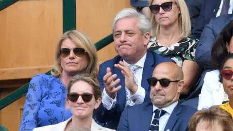 Getty Images John Bercow with his wife Sally at Wimbledon