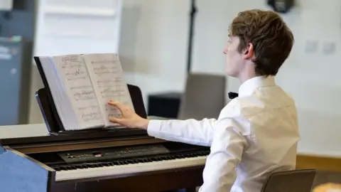 Chris Lloyd David George Harrington at the piano during rehearsals