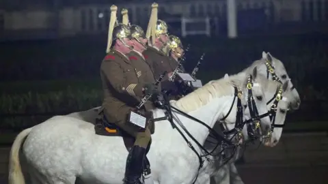 PA Media Many of the military personnel will journey along the procession on horseback