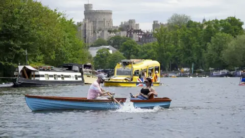 PA Media People enjoy boats on the River Thames in Windsor, Berkshire