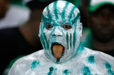 DANIEL BELOUMOU OLOMO/AFP A Nigeria supporter reacts during the Africa Cup of Nations final.