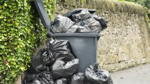 Getty Images An overflowing bin