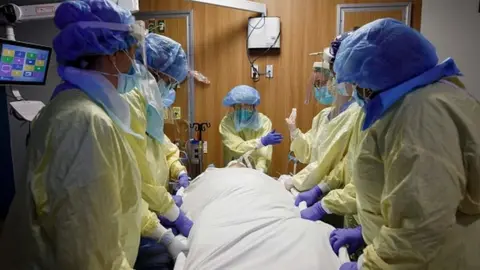 Getty Images Canadian healthcare workers with a Covid-19 patient in April 2021.