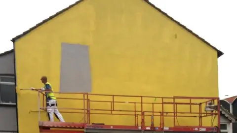 MurWalls Wall being painted yellow