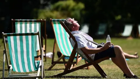 Getty Images Man in deck chair in sun